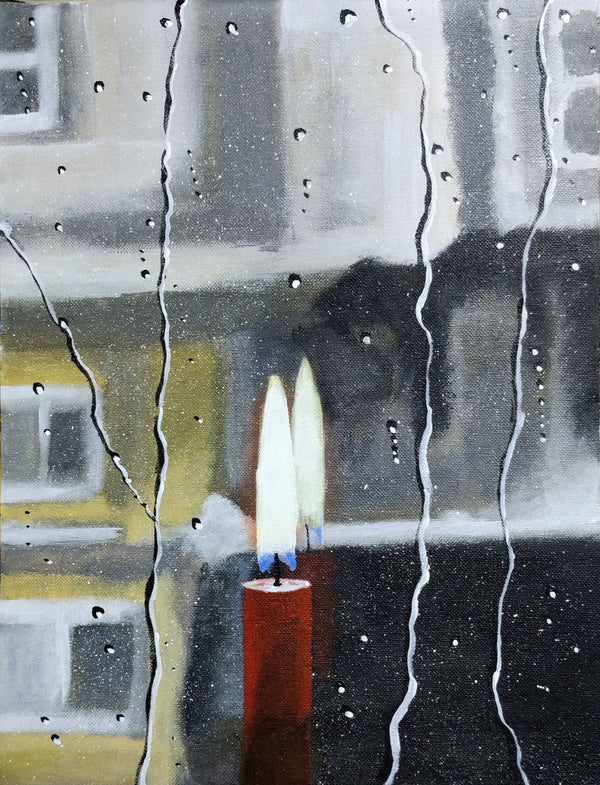 Candle and a rainy window