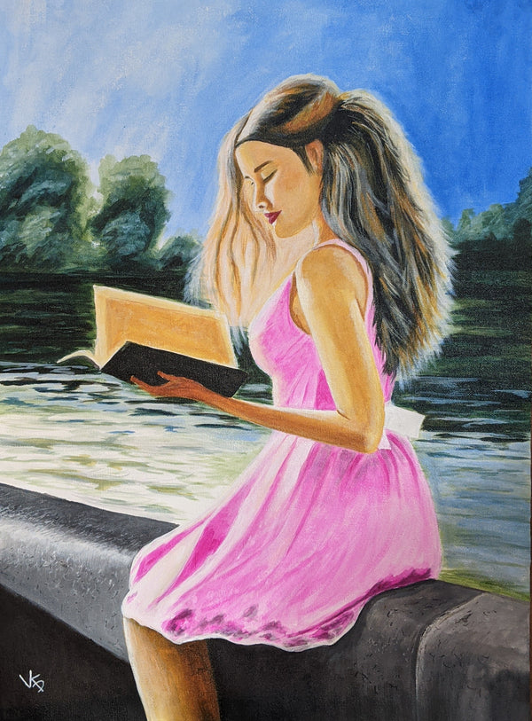 A girl reading book at the river side