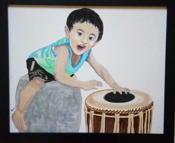 Boy playing Mridangam