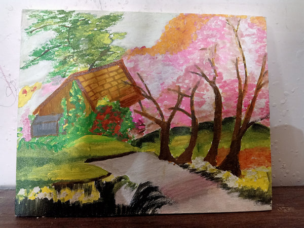 Hut with pink flower trees